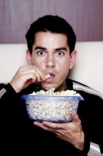 3240092_com_3192526_man_eating_popcorn_while_watching_movie.jpg
