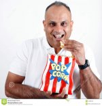 office-worker-eating-popcorn-15568428.jpg