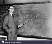 1930s-1940s-man-teacher-professor-pointing-pointer-at-blackboard-looking-AAN29G.jpg