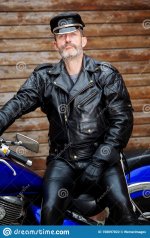 portrait-sexy-biker-dressed-black-leather-sitting-his-bike-sexy-biker-dressed-black-leather-si...jpg